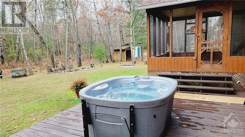 Includes 2022 hot tub - 215 Fireside Drive, Constance Bay, ON - Outdoor With Deck Patio Veranda