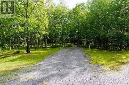 Easy access to large side yard for storing recreational toys with large parking  pad - 215 Fireside Drive, Constance Bay, ON - Outdoor