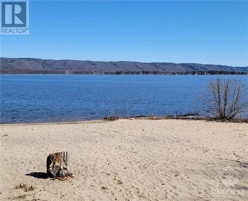 Short walk to the beach - 215 Fireside Drive, Constance Bay, ON - Outdoor With Body Of Water With View