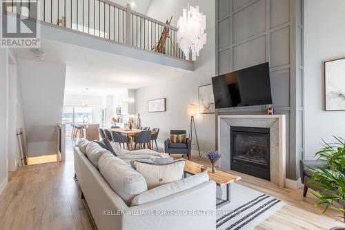 4 - 744 Nelson Street W, Norfolk, ON - Indoor Photo Showing Living Room With Fireplace