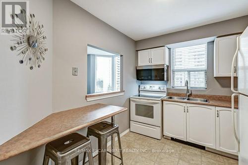 #501 -1270 Maple Crossing Blvd, Burlington, ON - Indoor Photo Showing Kitchen With Double Sink