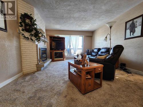 308 1654 10Th Avenue, Prince George, BC - Indoor Photo Showing Living Room With Fireplace