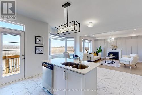 20 Marlene Johnstone Drive, East Gwillimbury, ON - Indoor Photo Showing Kitchen With Fireplace With Double Sink