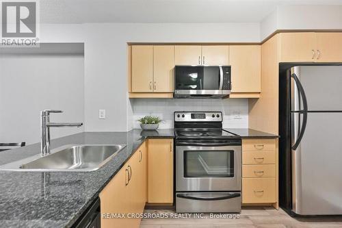 #518 -27 Rean Dr, Toronto, ON - Indoor Photo Showing Kitchen With Stainless Steel Kitchen