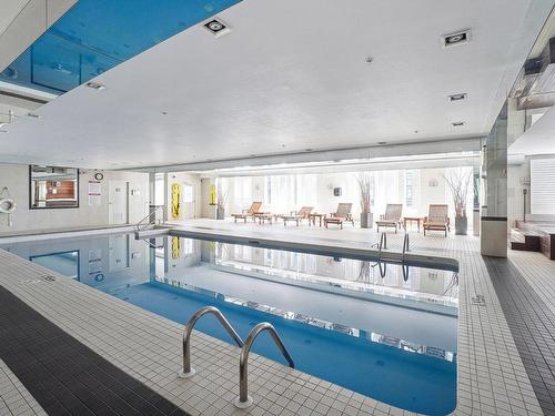 Piscine - 603-2160 Av. Terry-Fox, Laval (Chomedey), QC - Indoor Photo Showing Other Room With In Ground Pool