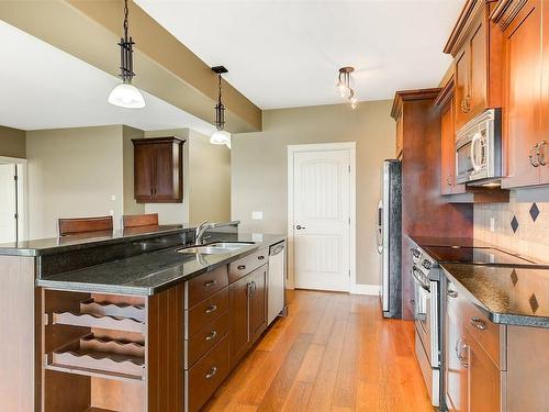 108-4350 Ponderosa Drive, Peachland, BC - Indoor Photo Showing Kitchen With Double Sink