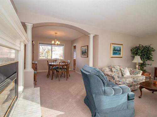 1421 Lombardy Square, Kelowna, BC - Indoor Photo Showing Living Room With Fireplace