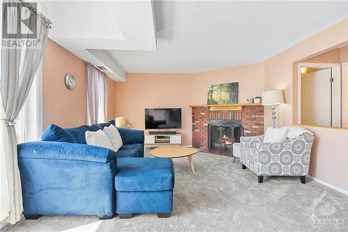 20 Shehyn Lane Unit#C, Ottawa, ON - Indoor Photo Showing Living Room With Fireplace