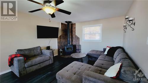 1394 Snye Road, White Lake, ON - Indoor Photo Showing Living Room With Fireplace