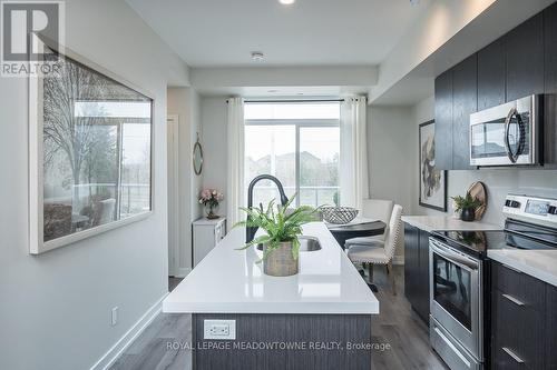 #204 -3058 Sixth Line, Oakville, ON - Indoor Photo Showing Kitchen With Upgraded Kitchen