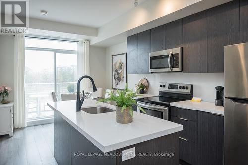 #204 -3058 Sixth Line, Oakville, ON - Indoor Photo Showing Kitchen With Stainless Steel Kitchen With Upgraded Kitchen