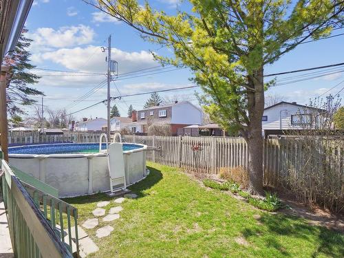 Cour - 185 Rue Chapleau, Dollard-Des-Ormeaux, QC - Outdoor With Above Ground Pool