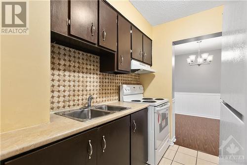2044 Arrowsmith Drive Unit#102C, Ottawa, ON - Indoor Photo Showing Kitchen With Double Sink