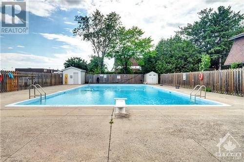2044 Arrowsmith Drive Unit#102C, Ottawa, ON - Outdoor With In Ground Pool With Backyard
