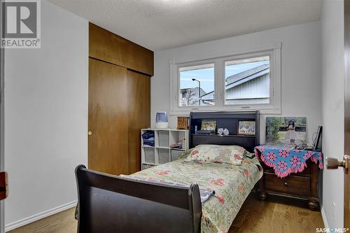 3 Walden Crescent, Regina, SK - Indoor Photo Showing Bedroom With Fireplace