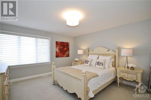 Primary Bedroom with Large Walk-In Closet and  4 Piece En-Suite - 338 Kilspindie Ridge, Ottawa, ON - Indoor Photo Showing Bedroom