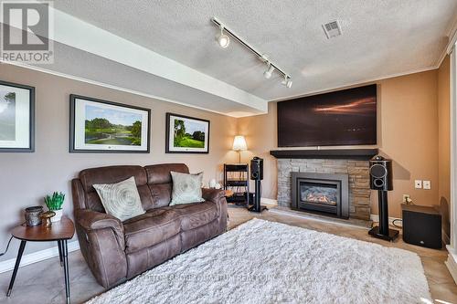 57 Decarie Circ, Toronto, ON - Indoor Photo Showing Living Room With Fireplace