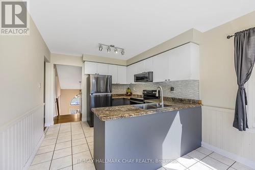 32 Michael St, Essa, ON - Indoor Photo Showing Kitchen With Double Sink