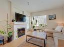 202-4394 West Saanich Rd, Saanich, BC  - Indoor Photo Showing Living Room With Fireplace 