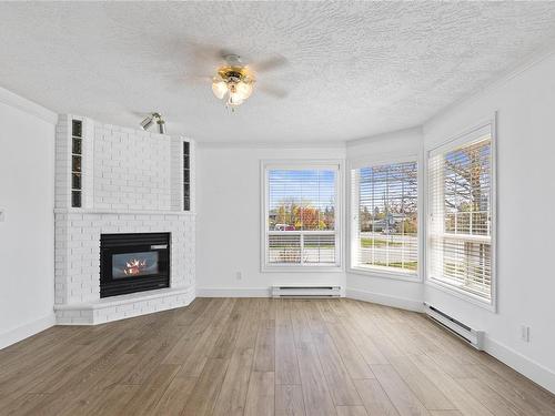 107 Acacia St, Parksville, BC - Indoor Photo Showing Living Room With Fireplace
