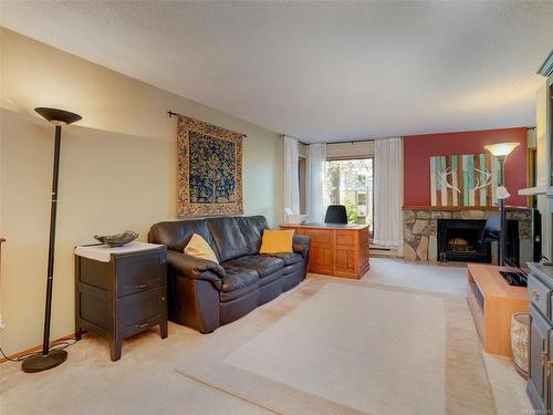 104-1518 Pandora Ave, Victoria, BC - Indoor Photo Showing Living Room With Fireplace