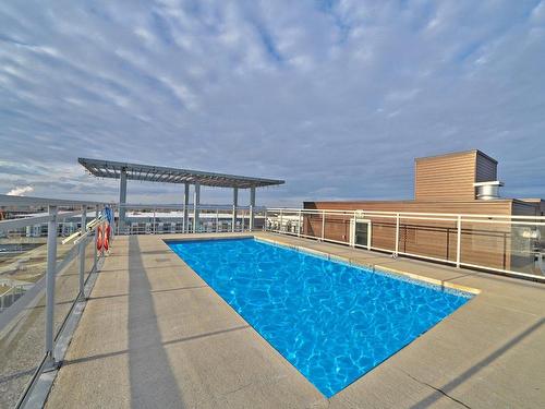 Piscine - 203-50 Rue D'Ambre, Candiac, QC - Outdoor With In Ground Pool With View