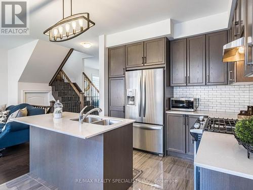 7 Dolobram Trail, Brampton, ON - Indoor Photo Showing Kitchen With Stainless Steel Kitchen With Double Sink With Upgraded Kitchen