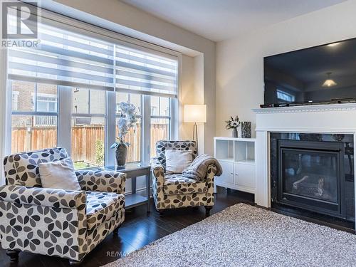 7 Dolobram Trail, Brampton, ON - Indoor Photo Showing Living Room With Fireplace