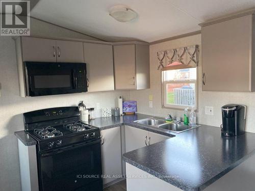 #217 -1051 Line 8 Rd, Niagara-On-The-Lake, ON - Indoor Photo Showing Kitchen With Double Sink