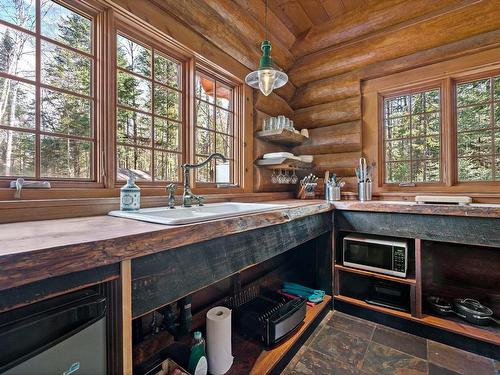 Kitchen - 1061 Ch. De La Sauvagine, Mont-Blanc, QC - Indoor With Fireplace