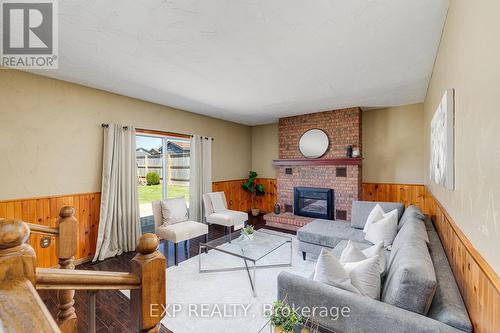 475 Victoria Avenue S, North Perth, ON - Indoor Photo Showing Living Room With Fireplace
