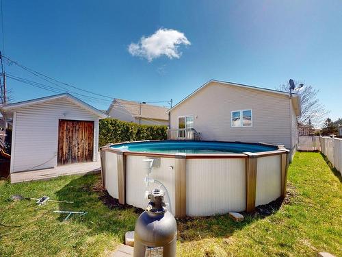 Cour - 14 Rue Des Pilets, Lavaltrie, QC - Outdoor With Above Ground Pool With Exterior