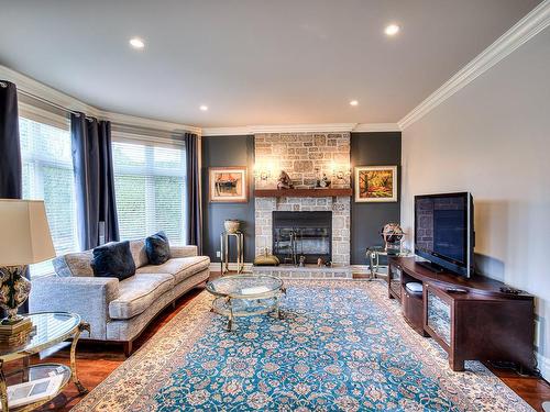 Salle familiale - 9 Rue D'Amboise, Blainville, QC - Indoor Photo Showing Living Room With Fireplace