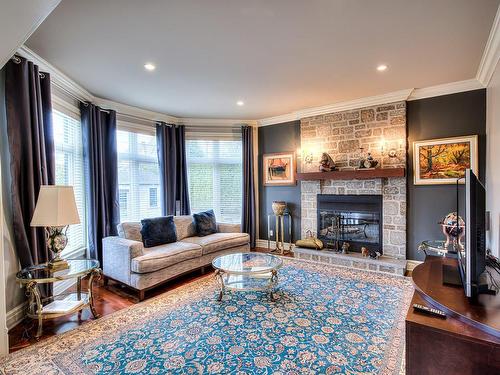 Salle familiale - 9 Rue D'Amboise, Blainville, QC - Indoor Photo Showing Living Room With Fireplace