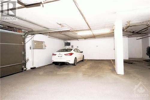 Garage parking #14 - 316 Savard Avenue Unit#311, Ottawa, ON - Indoor Photo Showing Garage