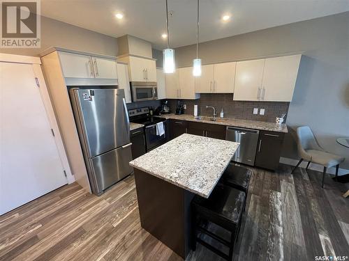 202 415 Maningas Bend, Saskatoon, SK - Indoor Photo Showing Kitchen With Stainless Steel Kitchen With Upgraded Kitchen