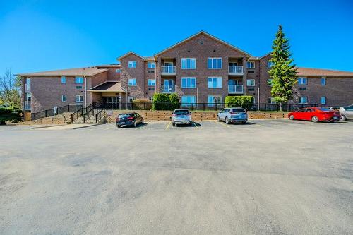 Beautifully maintained complex with plenty of visitors parking. - 3050 Pinemeadow Drive|Unit #57, Burlington, ON - Outdoor With Balcony With Facade