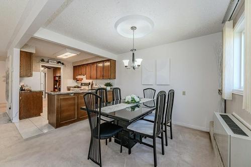 Dining room conveniently located beside the kitchen - 3050 Pinemeadow Drive|Unit #57, Burlington, ON - Indoor Photo Showing Dining Room