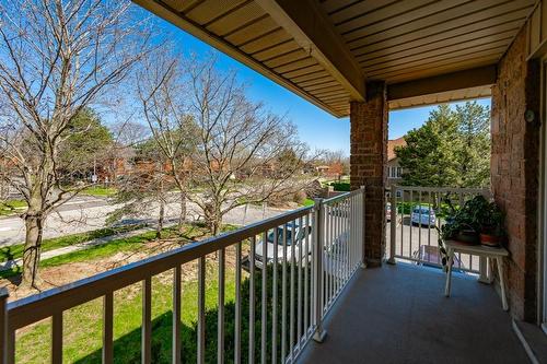 Enjoy the balcony and many trees surrounding the property - 3050 Pinemeadow Drive|Unit #57, Burlington, ON - Outdoor With Balcony With Exterior