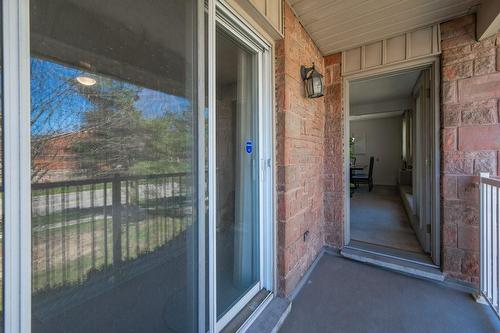 Sliding doors from the primary bedroom to the balcony - 3050 Pinemeadow Drive|Unit #57, Burlington, ON - Outdoor With Balcony With Exterior