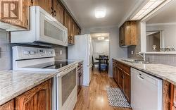 Galley Kitchen with Oak Cabinets - 