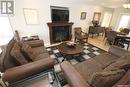 2082 Laurier Bay E, Regina, SK  - Indoor Photo Showing Living Room With Fireplace 