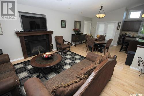 2082 Laurier Bay E, Regina, SK - Indoor Photo Showing Living Room With Fireplace