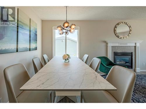 1059 Mt Fosthall Drive, Vernon, BC - Indoor Photo Showing Dining Room With Fireplace