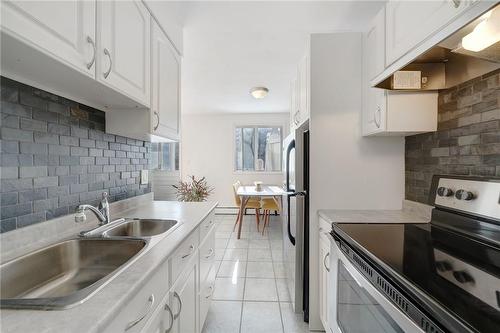 101 Queen Street S|Unit #501, Hamilton, ON - Indoor Photo Showing Kitchen With Double Sink