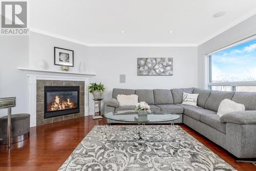 12 Rachlin Dr, Halton Hills, ON - Indoor Photo Showing Living Room With Fireplace
