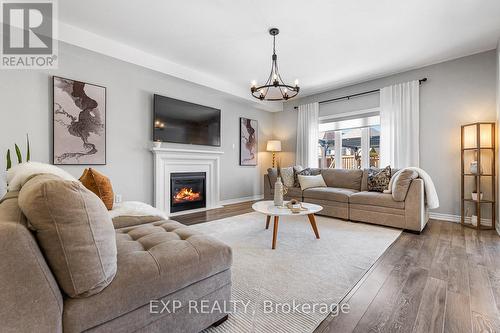 42 Hackett St, New Tecumseth, ON - Indoor Photo Showing Living Room With Fireplace