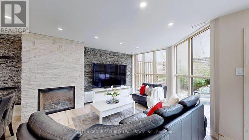 #Th 23 -100 Arbors Lane, Vaughan, ON - Indoor Photo Showing Living Room With Fireplace