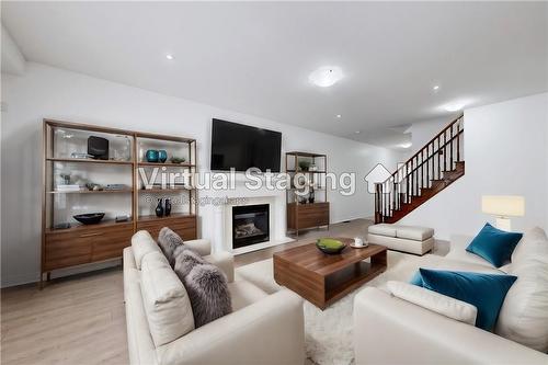 63 Chamomile Drive, Hamilton, ON - Indoor Photo Showing Living Room With Fireplace