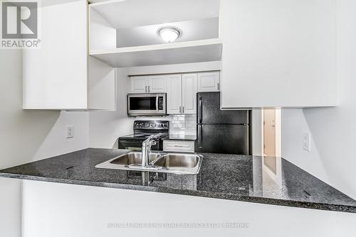 #909 -70 Town Centre Crt, Toronto, ON - Indoor Photo Showing Kitchen With Double Sink